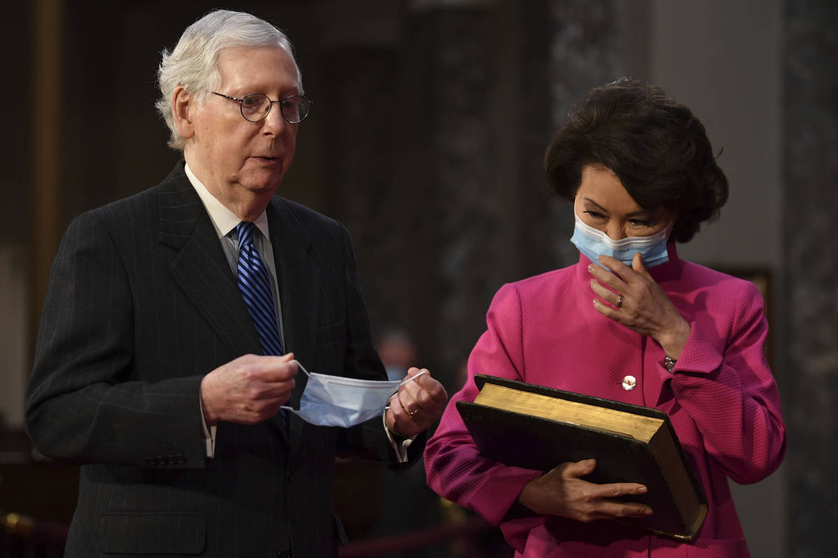 In this Jan. 3, 2021, file photo, Sen. Mitch McConnell, R-Ky., participates in a mock swearing ...