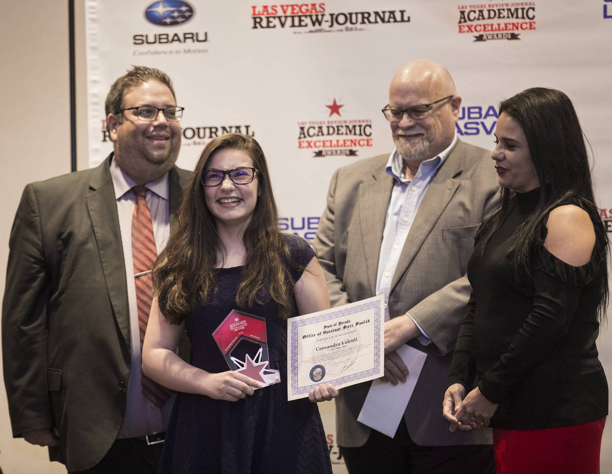 Award winner Cassandra Valenti, second from left, an eighth grader at Bob Miller Middle School, ...