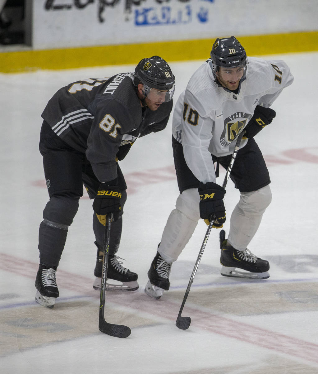 Golden Knights center Jonathan Marchessault (81) and Golden Knights center Nicolas Roy (10) on ...