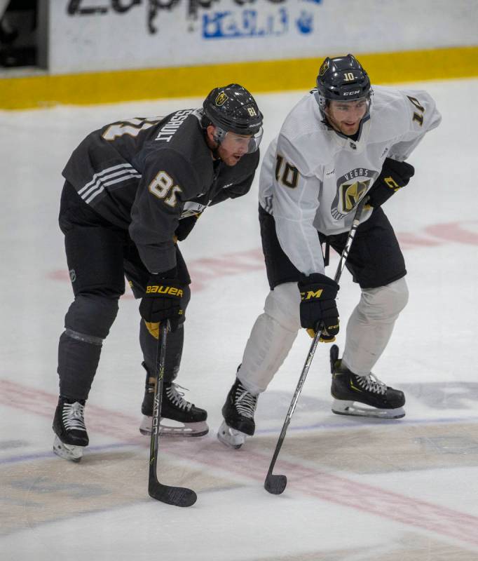 Golden Knights center Jonathan Marchessault (81) and Golden Knights center Nicolas Roy (10) on ...