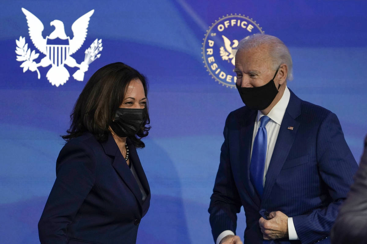 President-elect Joe Biden, right, and Vice President-elect Kamala Harris, left, share a laugh d ...