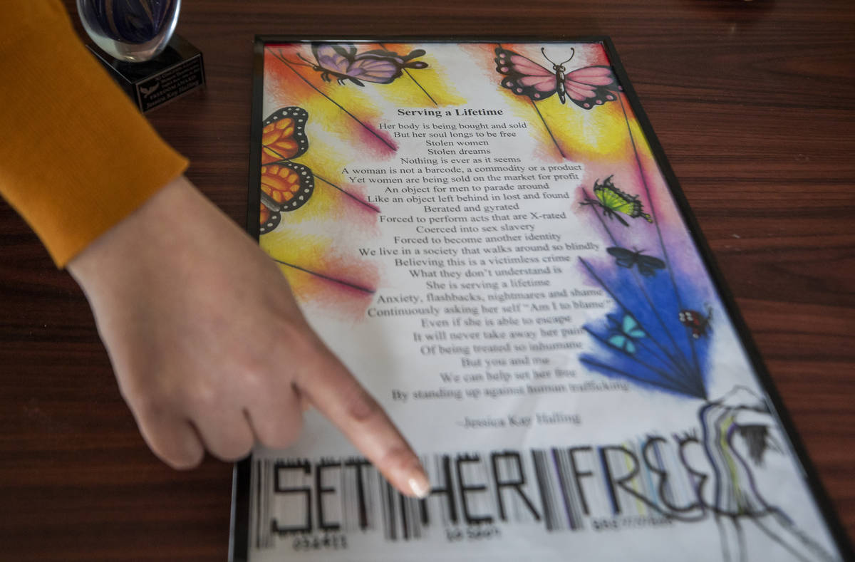 Youthcare program director Jessica Halling shows a poem she wrote, in her office at St. Jude's ...
