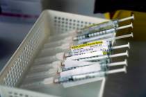 In a Jan. 7, 2021, file photo syringes containing the Pfizer-BioNTech COVID-19 vaccine sit in a ...