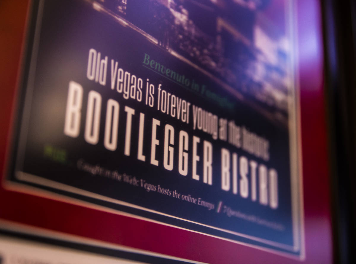 A framed poster promoting Bootlegger Bistro hangs in the lobby of the iconic Italian restaurant ...