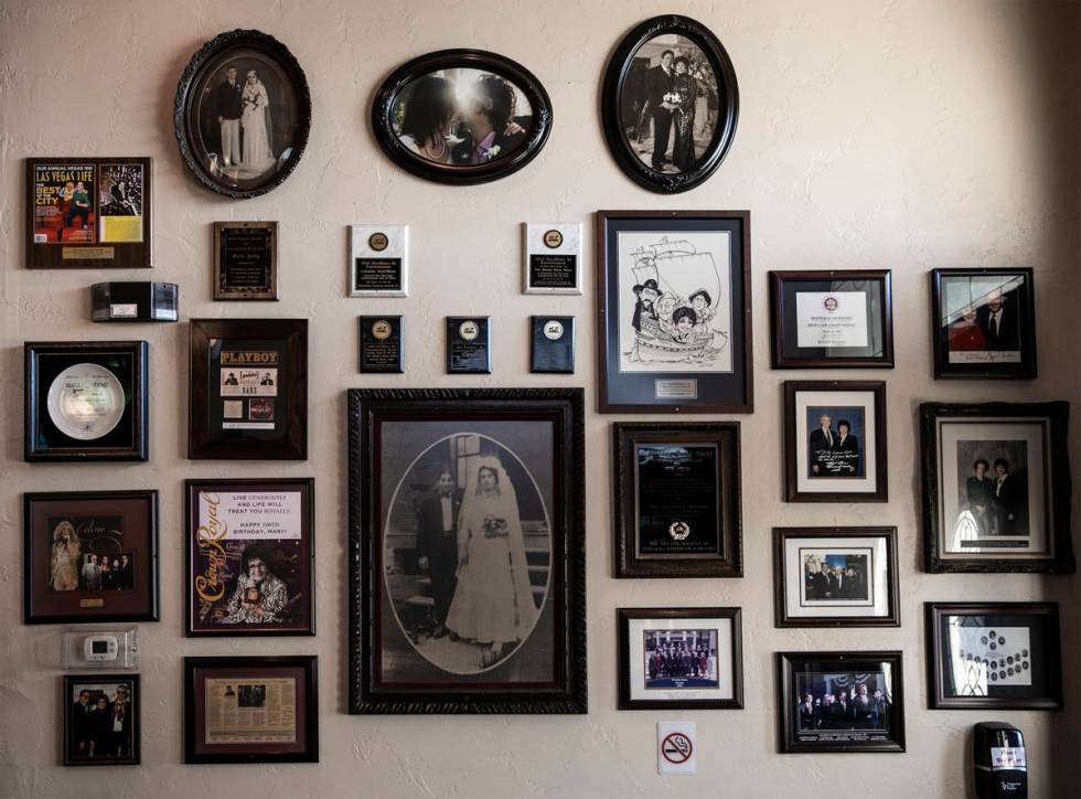 Photos of family, friends and famous guests hang in the lobby of Bootlegger Bistro on Wednesday ...