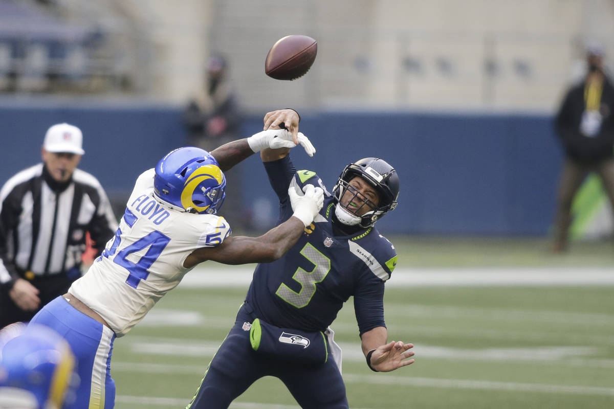 Los Angeles Rams outside linebacker Leonard Floyd (54) knocks the ball away as Seattle Seahawks ...