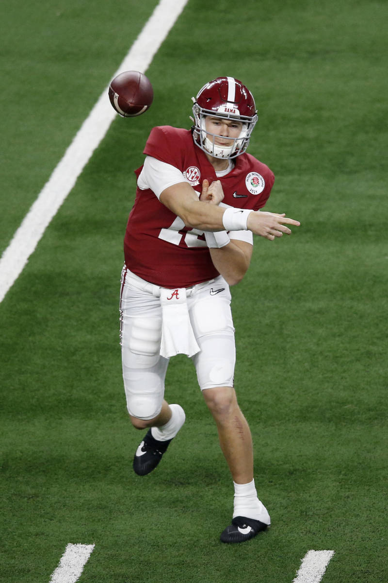 Alabama quarterback Mac Jones throws a pass during the first half of the Rose Bowl NCAA college ...