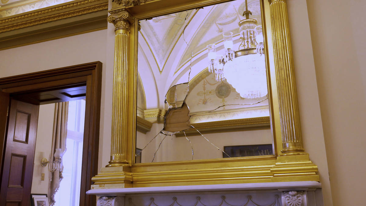 In an image provided by CBS News and "60 Minutes," a mirror is seen damaged in the pr ...
