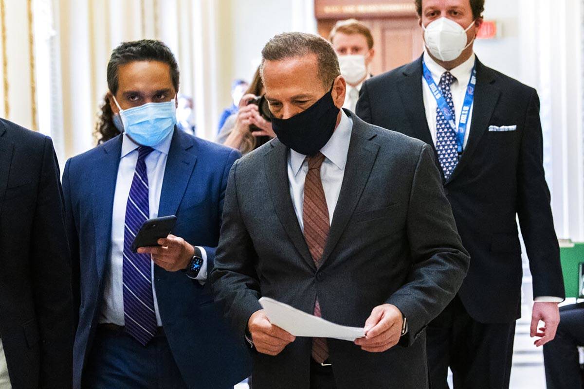 Rep. David Cicilline, D-R.I., is followed by reporters as he walks outside the House Chamber at ...