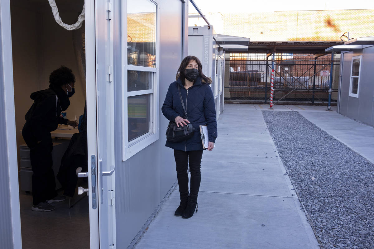 FILE - In this Sunday, Jan. 10, 2021, file photo, Claudia Zain, 47, of New York, checks in befo ...