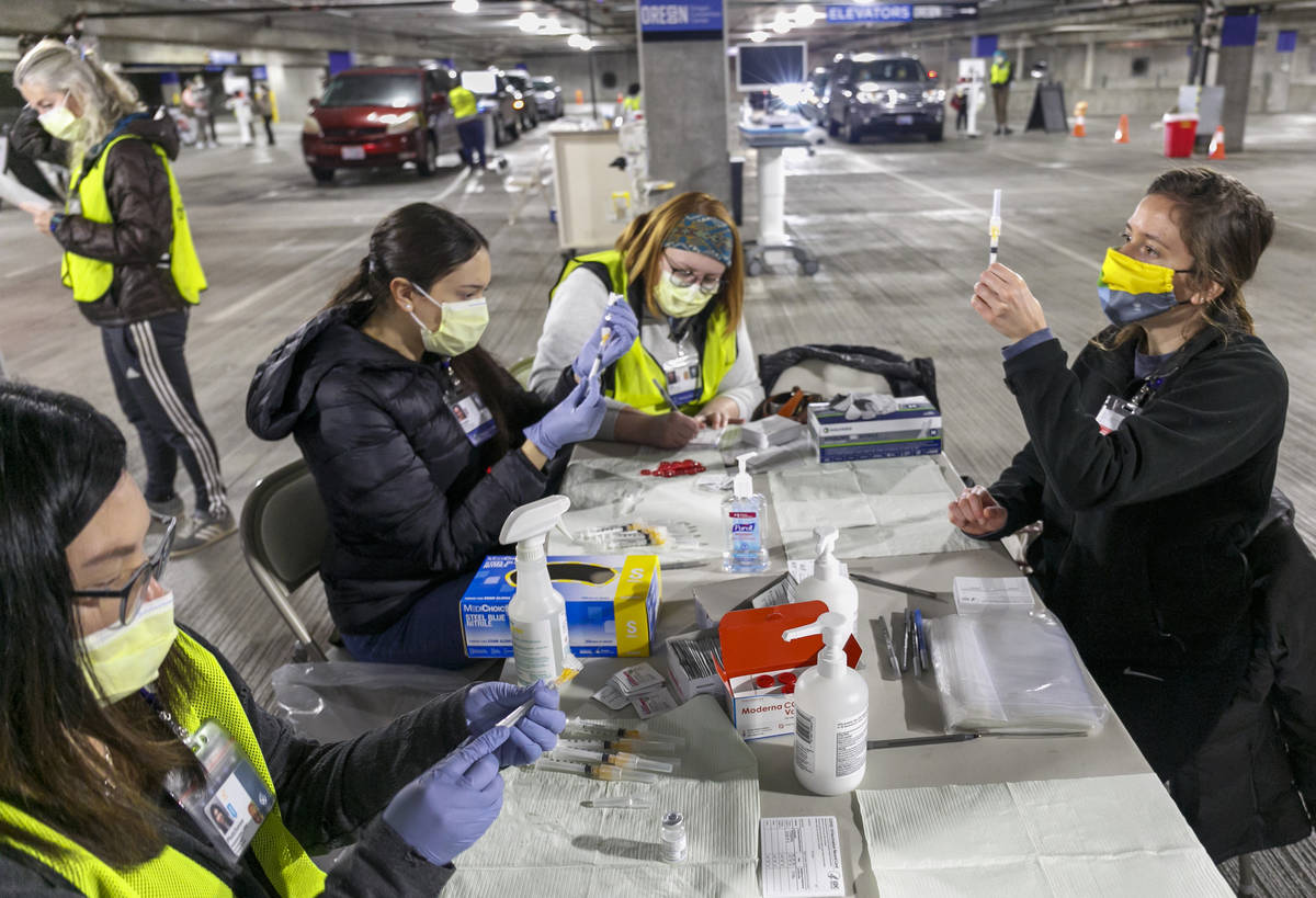 FILE - In this Sunday, Jan. 10, 2021, file photo, Medical professionals from Oregon Health &amp ...