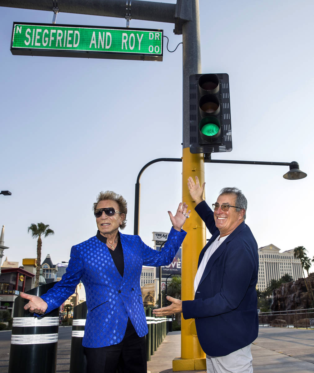 Siegfried Fischbacher, left, joined by Kenny Ortega along the Strip as the Mirage porte cochere ...