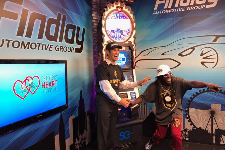 Jason Feinberg, co-host of Fox 5’s “More” show, cheers on Rapper Flavor Flav, who was tak ...