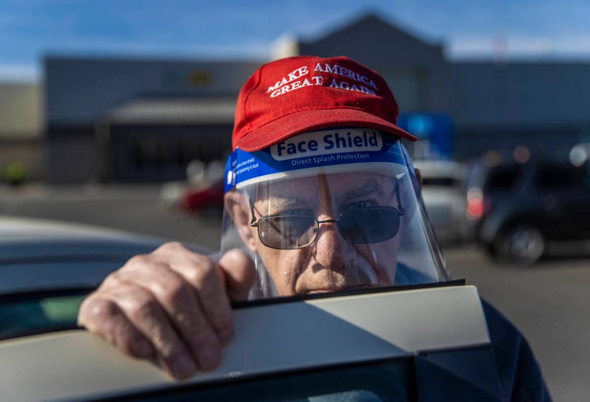Michael Butler, a supporter of President Trump, outside Walmart Supercenter on Monday, Jan. 11, ...