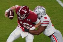 Ohio State linebacker Baron Browning forces a fumble by Alabama quarterback Mac Jones during th ...