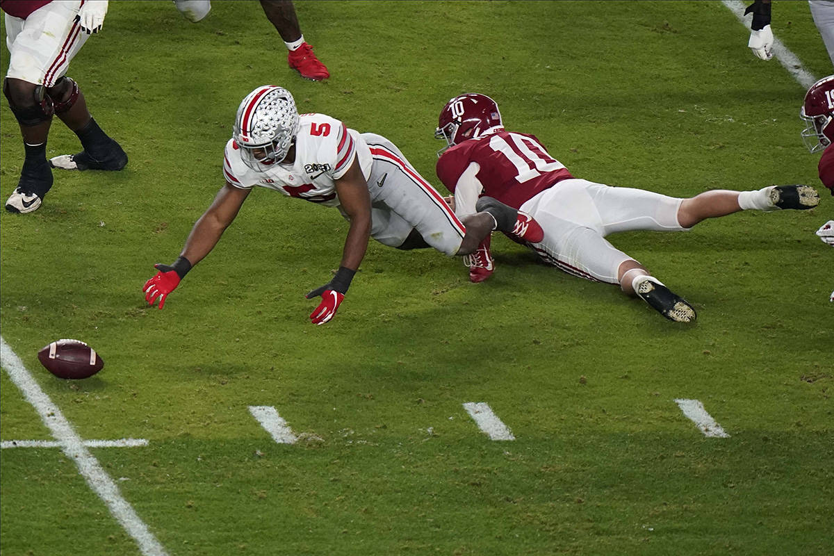 Ohio State linebacker Baron Browning recovers a fumble by Alabama quarterback Mac Jones during ...