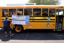 Bus driver Safet Husic prepares his school bus Wi-Fi hot spot in the Albertsons shopping center ...