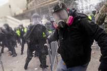 Trump supporters try to break through a police barrier, Wednesday, Jan. 6, 2021, at the Capitol ...