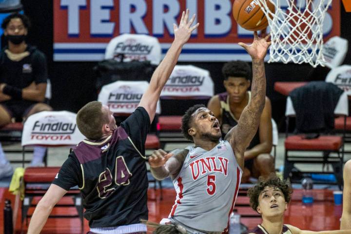 UNLV Rebels guard David Jenkins Jr. (5) gets off a touch shot past Saint Katherine guard/forwar ...