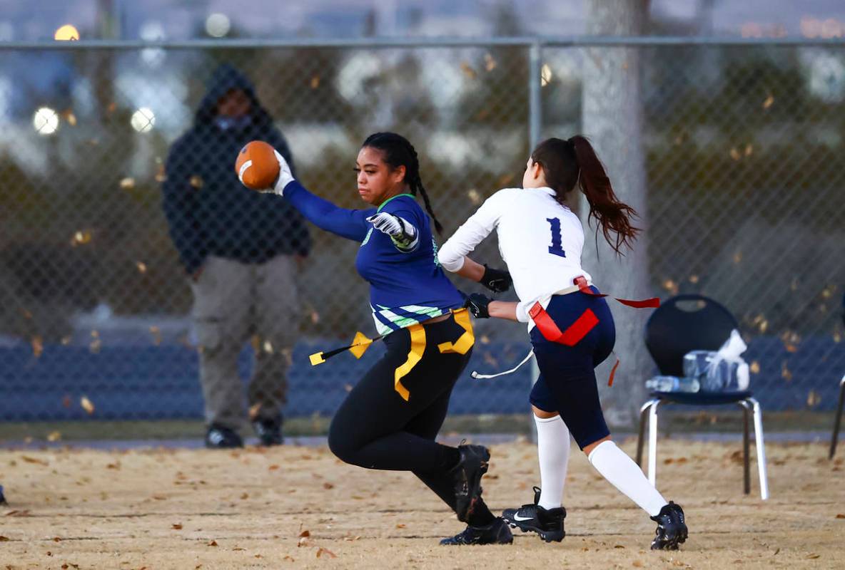 SLAM! Nevada's Sasha Ia (18) gets tagged out by Amplus Academy's Karina Hudzenko (1) during a f ...