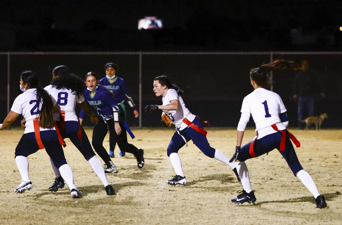 Amplus Academy Kaitlyn Pruitt (13) runs the ball after intercepting a pass from SLAM! Nevada du ...