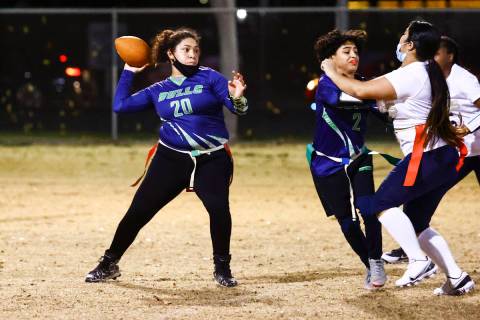 SLAM! Nevada's Lizette Valenciano looks to throw a pass during a flag football game against Amp ...
