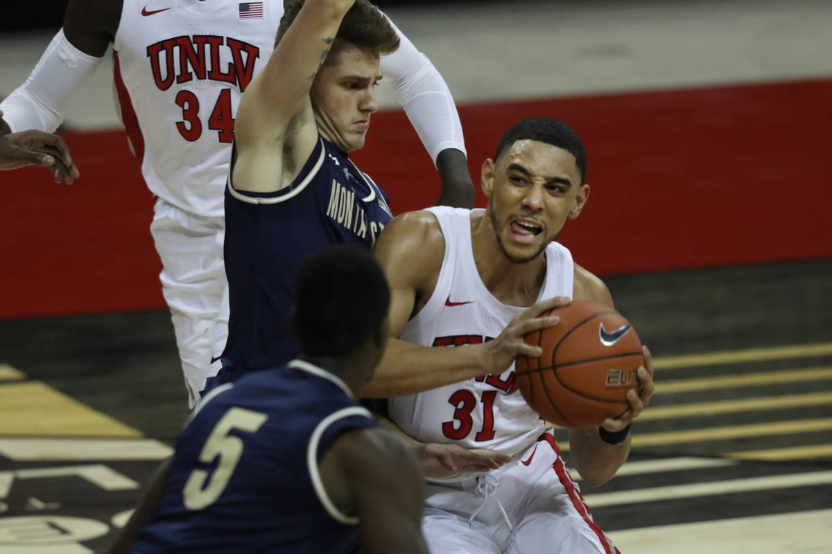 UNLV Rebels guard Marvin Coleman (31) is pressured by Montana State Bobcats guard Nick Gazelas ...