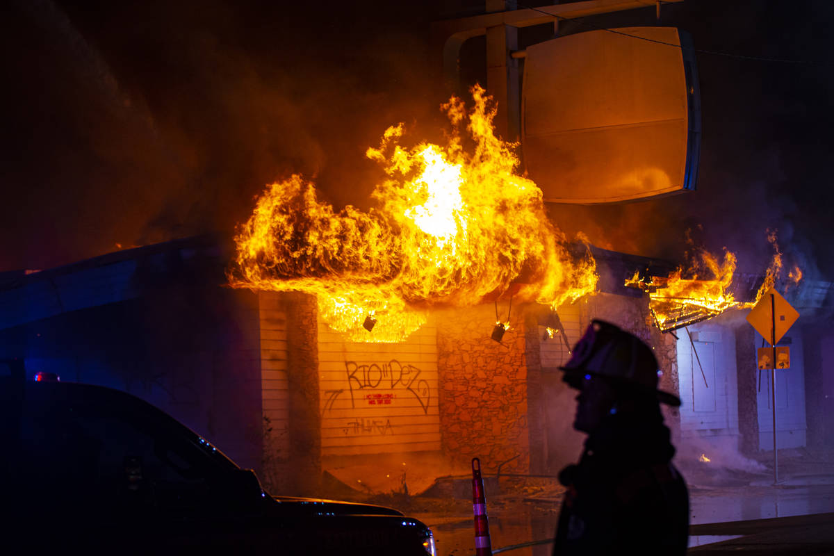 Las Vegas firefighters battle flames engulfing a vacant wedding chapel at 1431 S. Las Vegas Blv ...