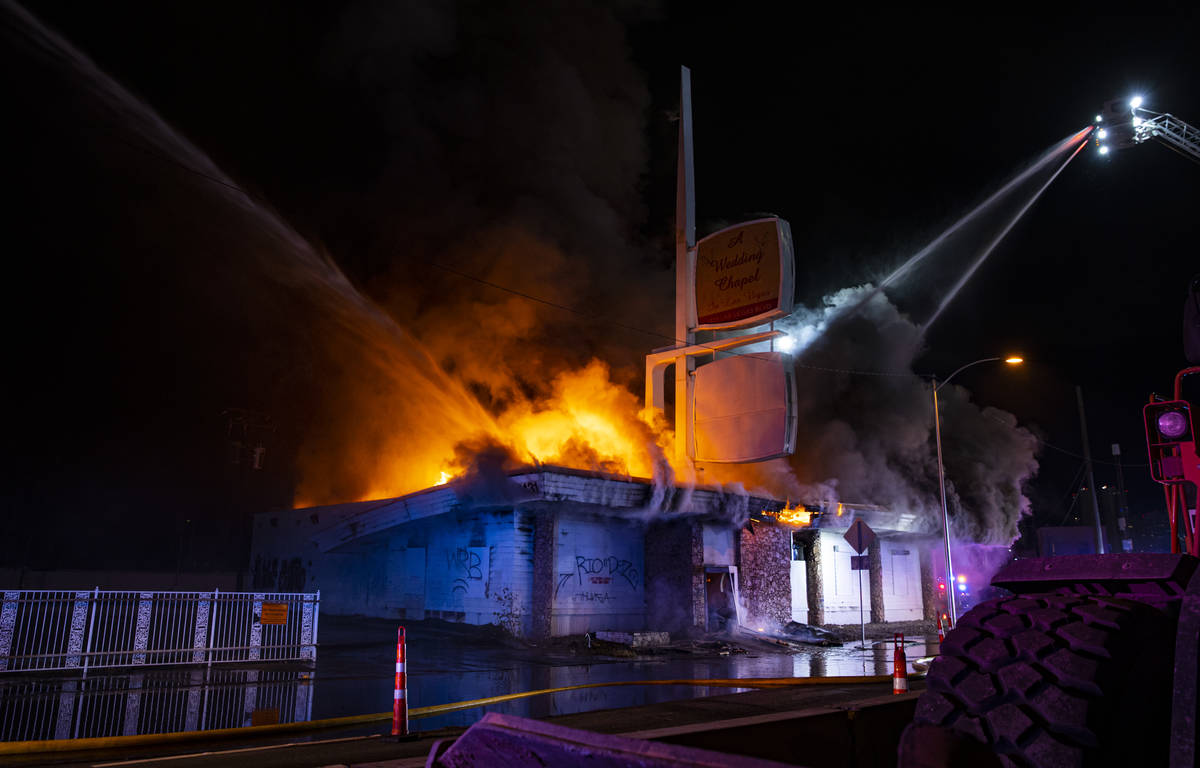 Las Vegas firefighters battle flames engulfing a vacant wedding chapel at 1431 S. Las Vegas Blv ...