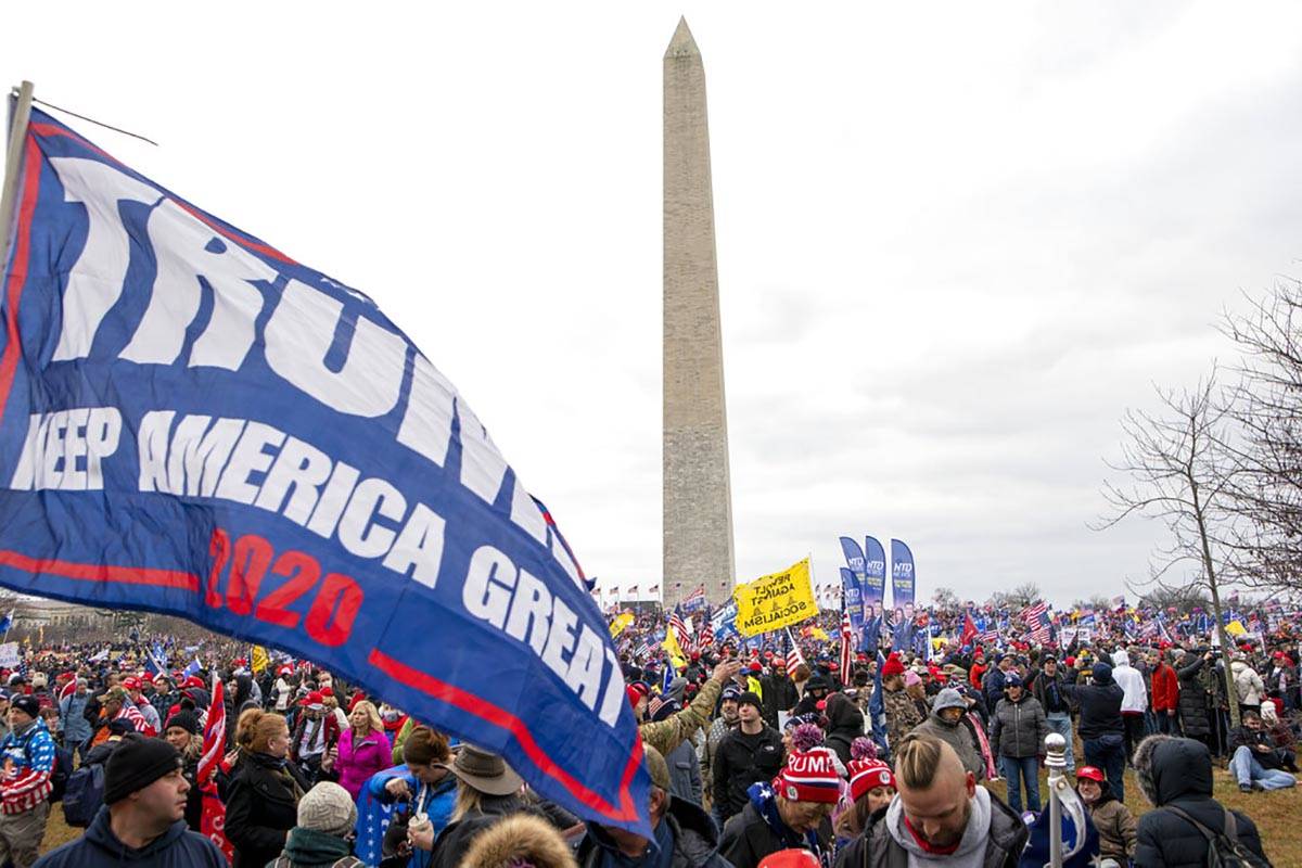 With the Washington Monument in the background, people attend a rally in support of President D ...