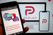 The website of the social media platform Parler is displayed in Berlin, Jan. 10, 2021. The plat ...