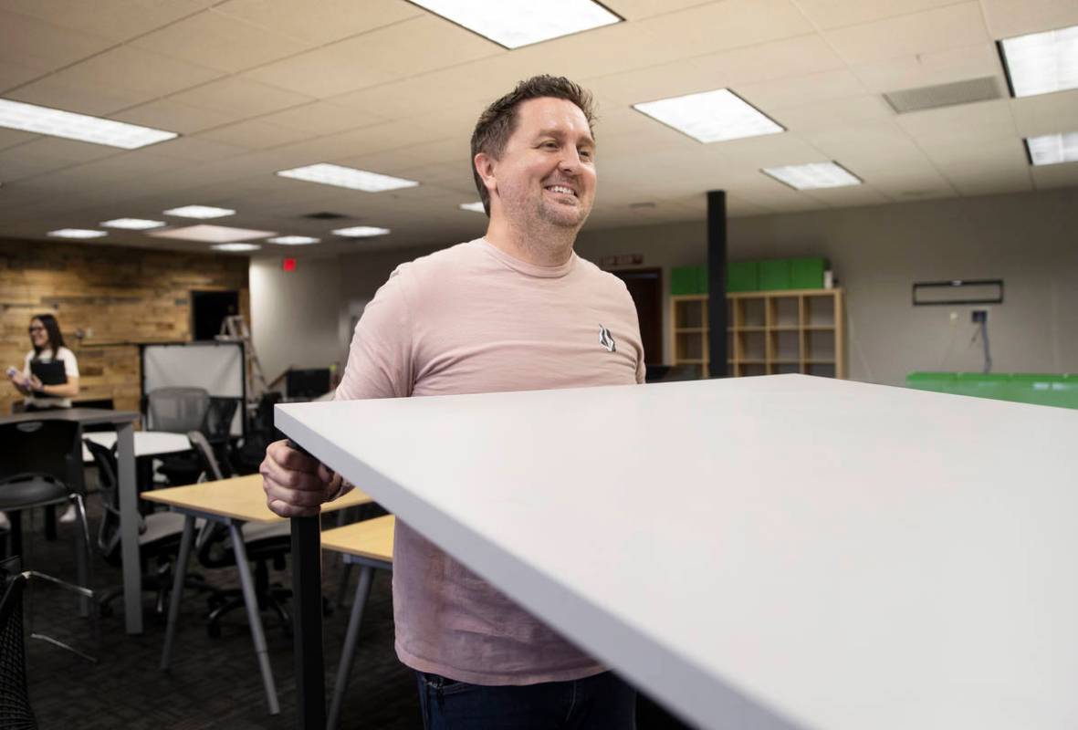 Kenny Eliason, co-owner of Work in Progress, lifts a table during the businesses last day on We ...