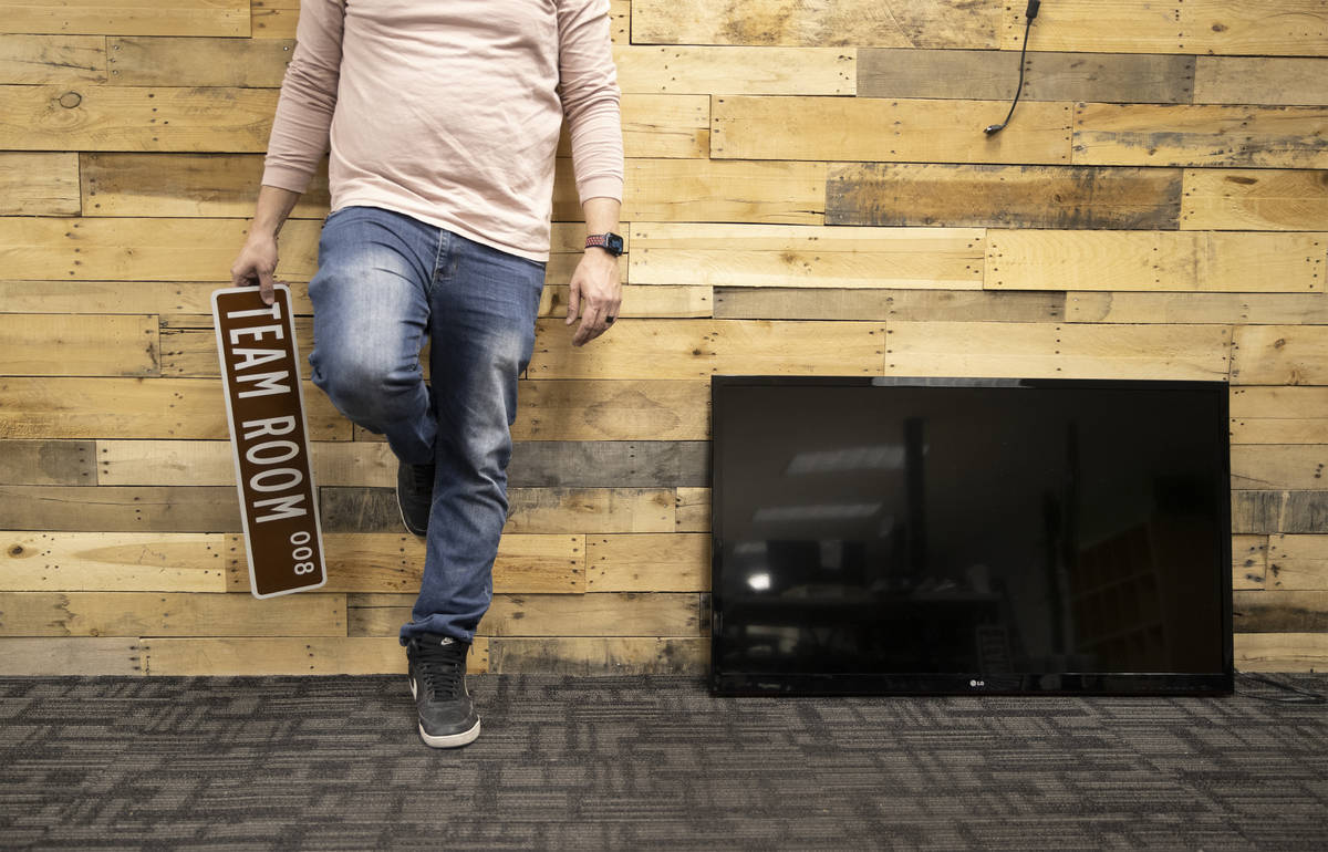 Kenny Eliason, co-owner of Work in Progress, takes a break from moving office equipment on the ...