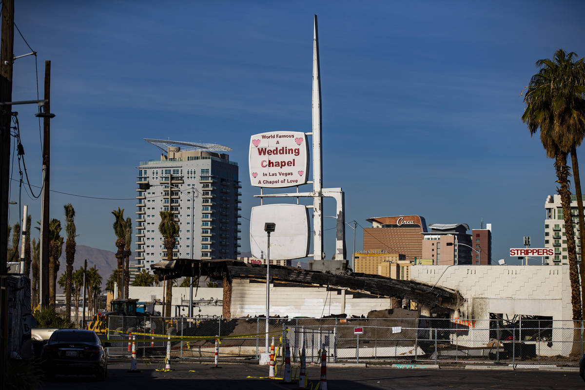 Investigators with the Clark County Coroner's Office and Las Vegas police examine the area afte ...