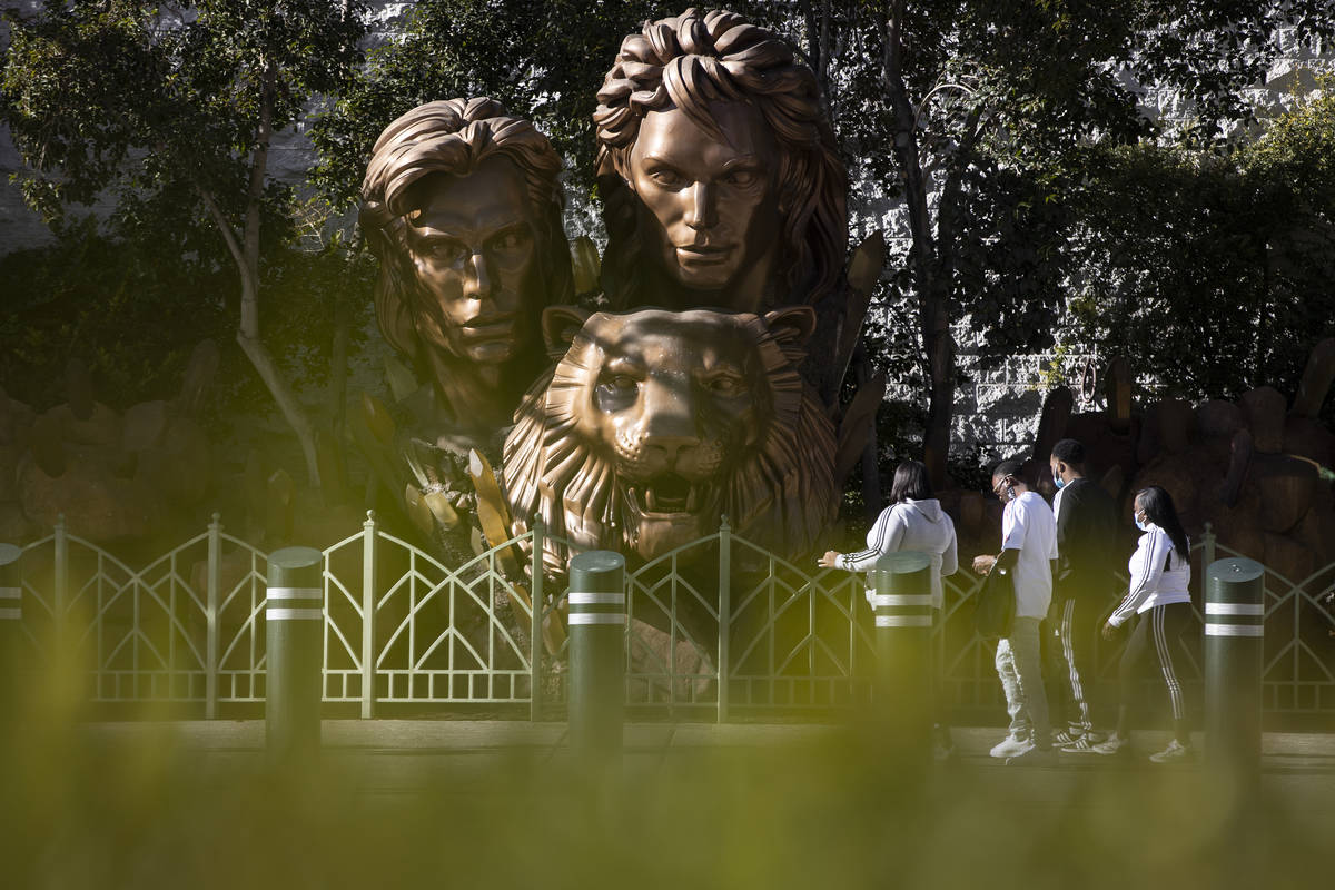 People walk in front of the Siegfried & Roy statue on the Strip in front of The Mirage hote ...