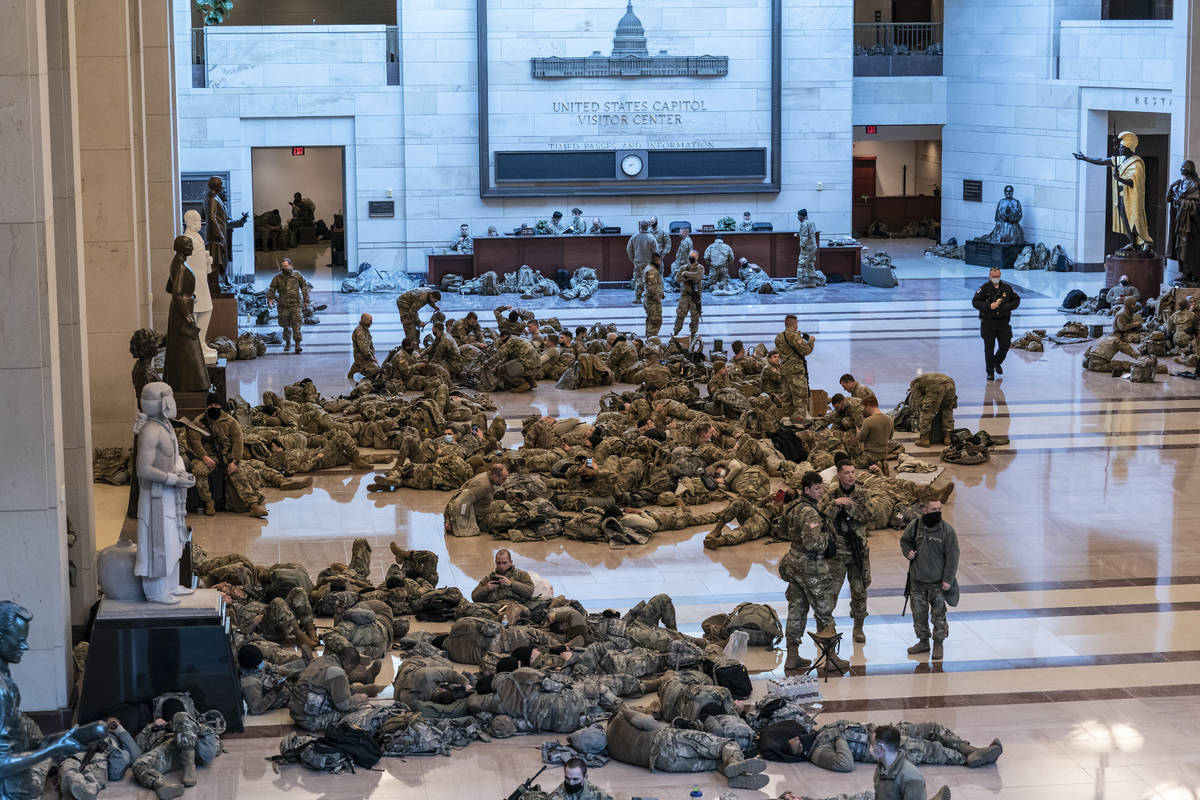 Hundreds of National Guard troops hold inside the Capitol Visitor's Center to reinforce securit ...