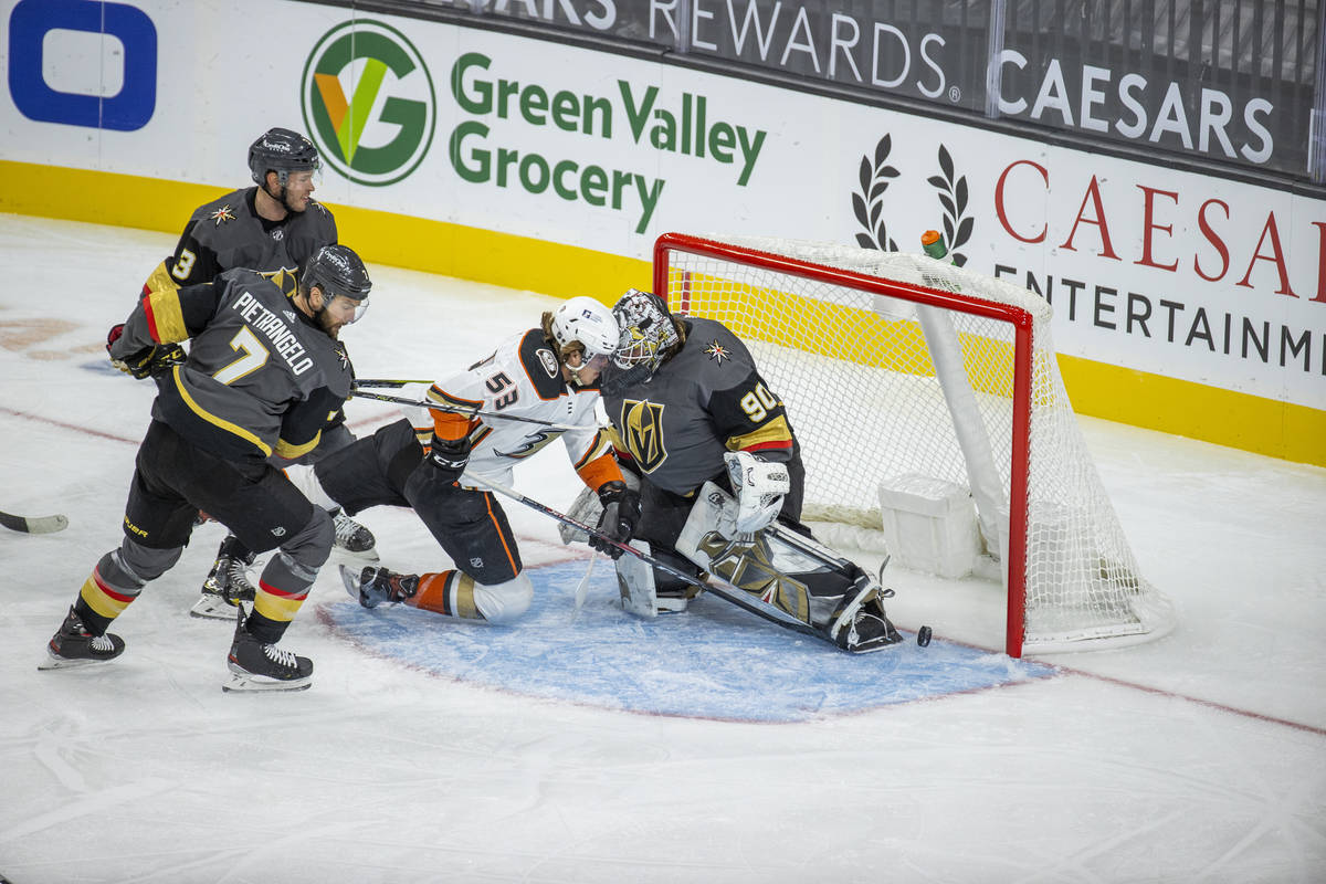 Anaheim Ducks forward Max Comtois (53) collides into Golden Knights goaltender Robin Lehner (90 ...