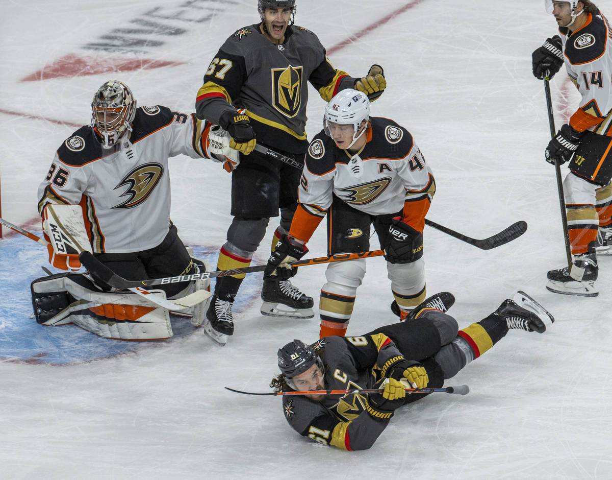 Golden Knights right wing Mark Stone (61) hits the ice after colliding with Anaheim Ducks defen ...