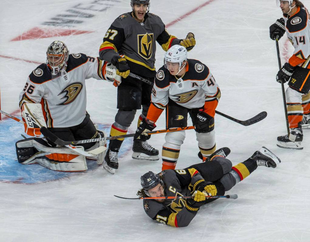 Golden Knights right wing Mark Stone (61) hits the ice after colliding with Anaheim Ducks defen ...