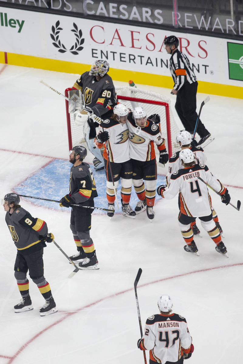 Anaheim Ducks defenseman Cam Fowler (4) skates in to congratulate forward Max Comtois (53) on h ...