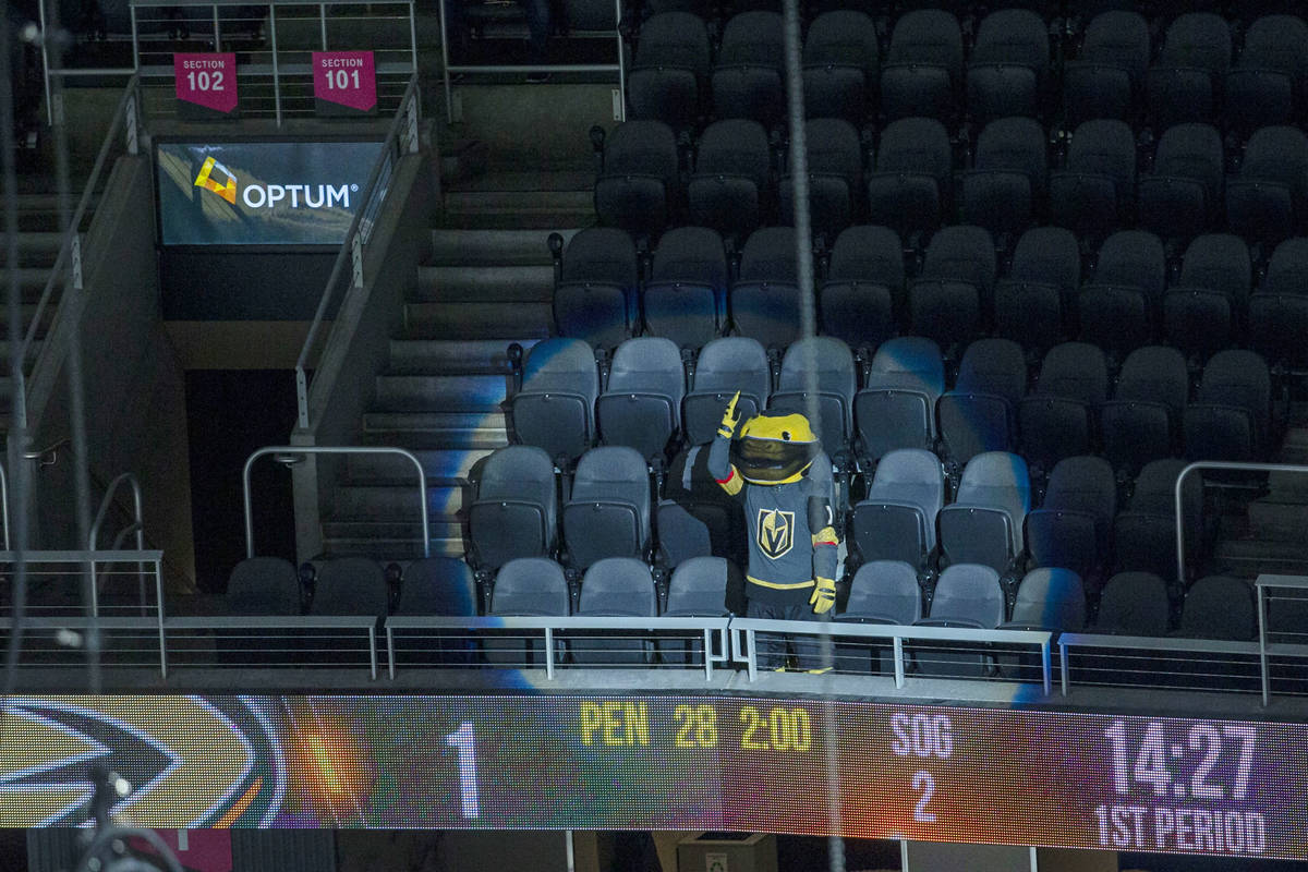 Vegas Golden Knights mascot Chance cheers on the team in an empty arena during the first period ...