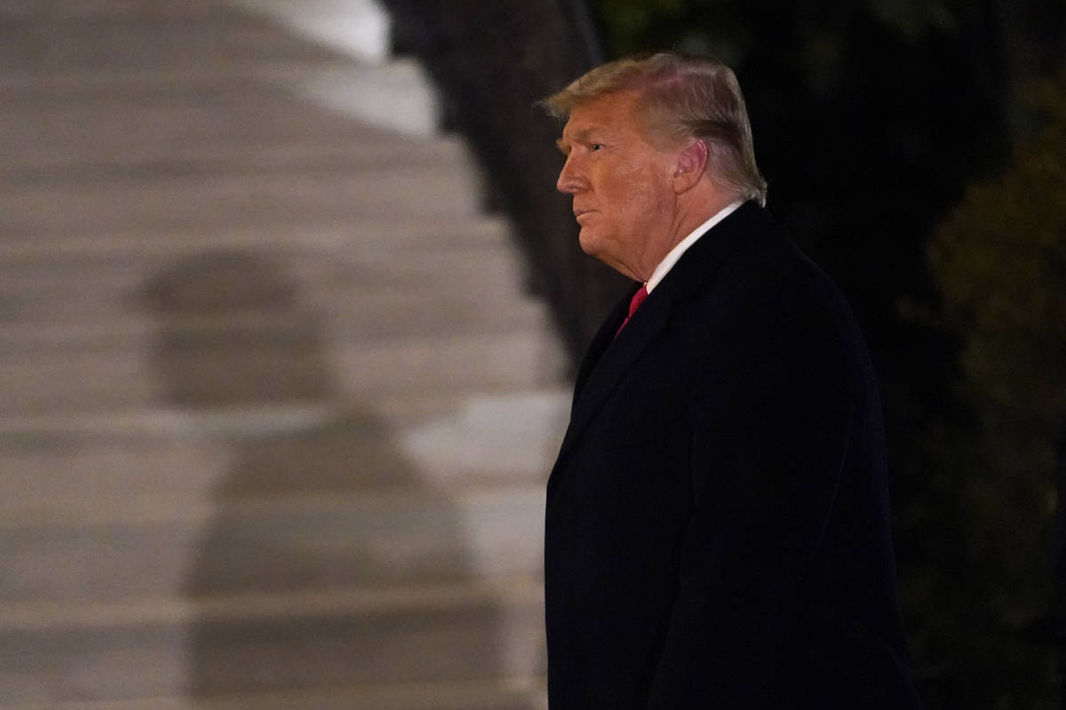 President Donald Trump arrives on the South Lawn of the White House, Tuesday, Jan. 12, 2021 in ...