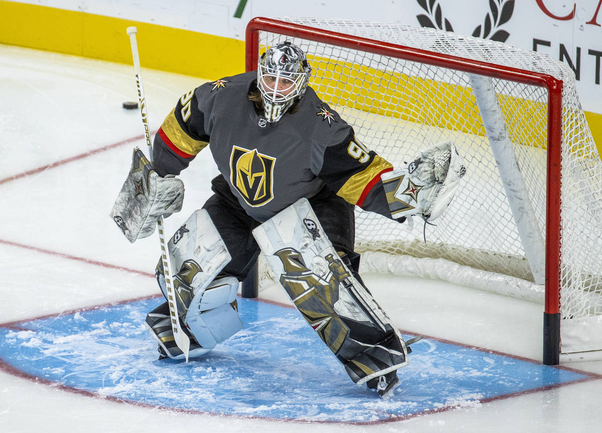 Golden Knights goaltender Robin Lehner (90) stops a puck from a teammate during the warm ups of ...