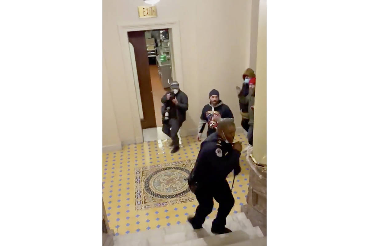 In this image made from video and provided by HuffPost, Capitol Police Officer Eugene Goodman c ...