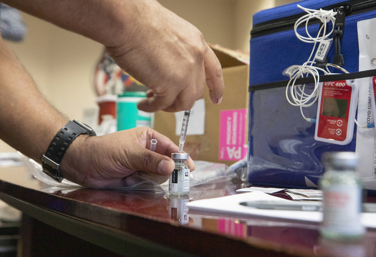 The North Las Vegas Fire Department administrates itÕs first batch of a COVID-19 vaccines ...