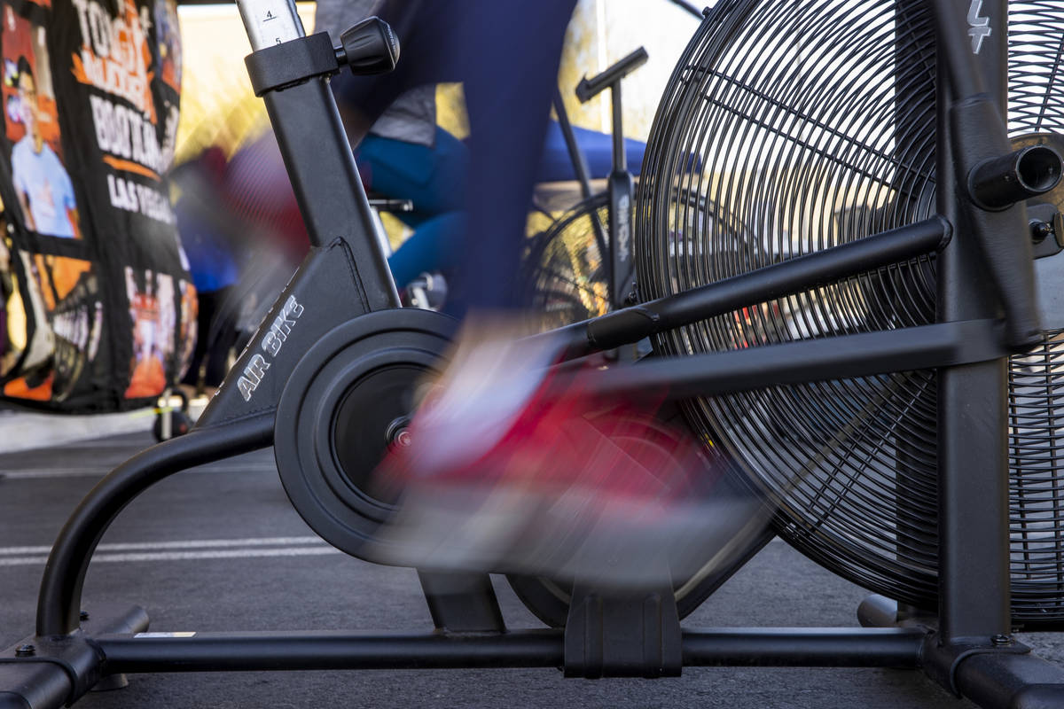 Greg Gollin pedals hard as Tough Mudder Bootcamp Las Vegas members pedal 96 miles on stationary ...