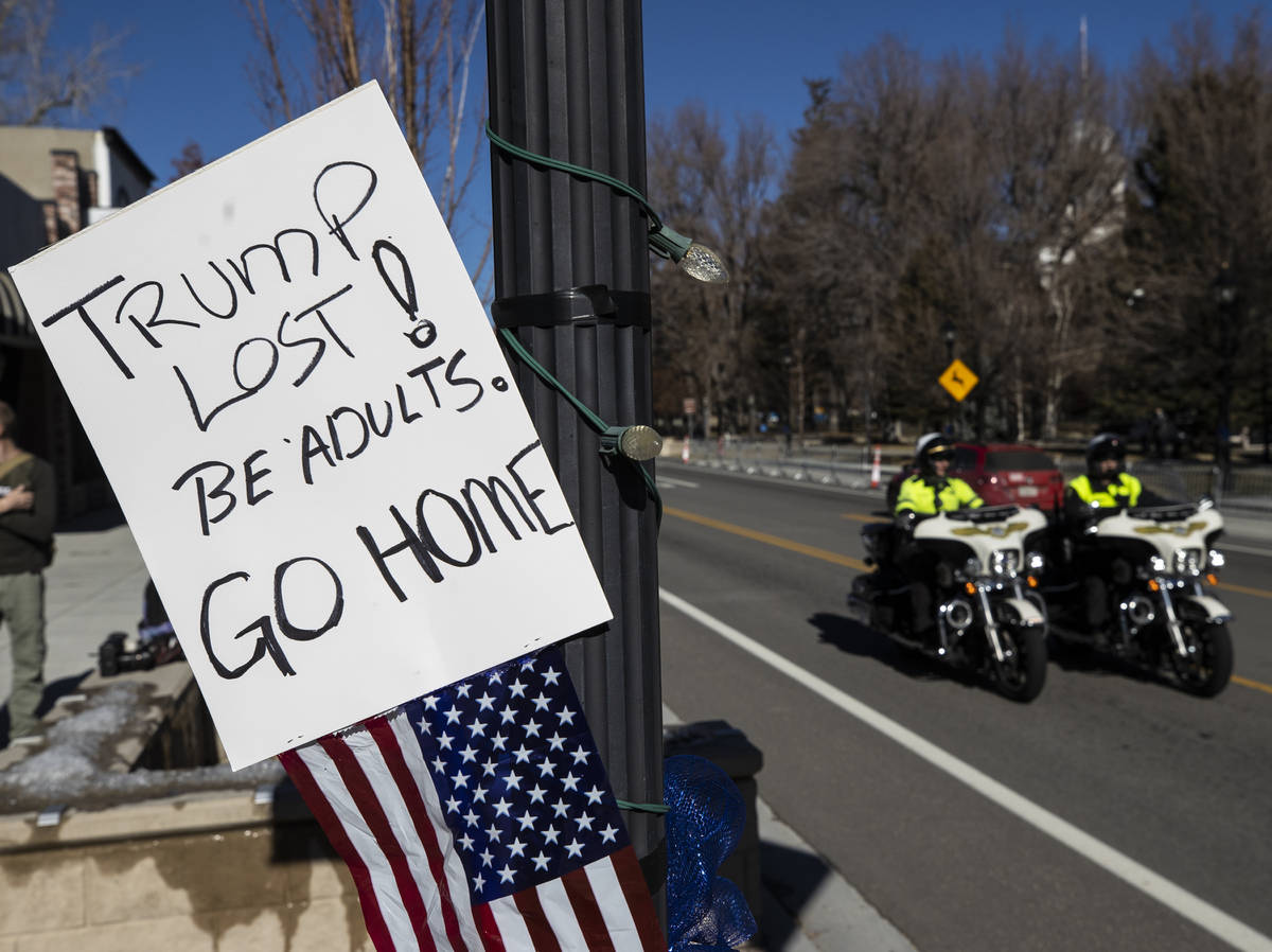 Law enforcement patrol the state Capitol complex on Sunday, Jan. 17, 2021, in Carson City, Nev. ...