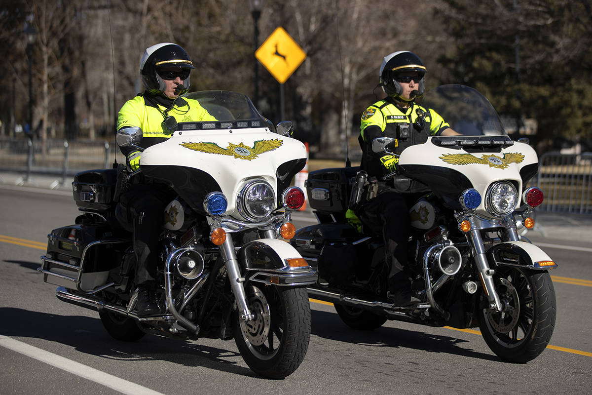 Law enforcement patrol the state Capitol complex on Sunday, Jan. 17, 2021, in Carson City, Nev. ...