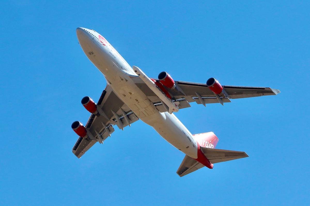 Virgin Orbit Boeing 747-400 rocket launch platform, named Cosmic Girl, takes off from Mojave Ai ...