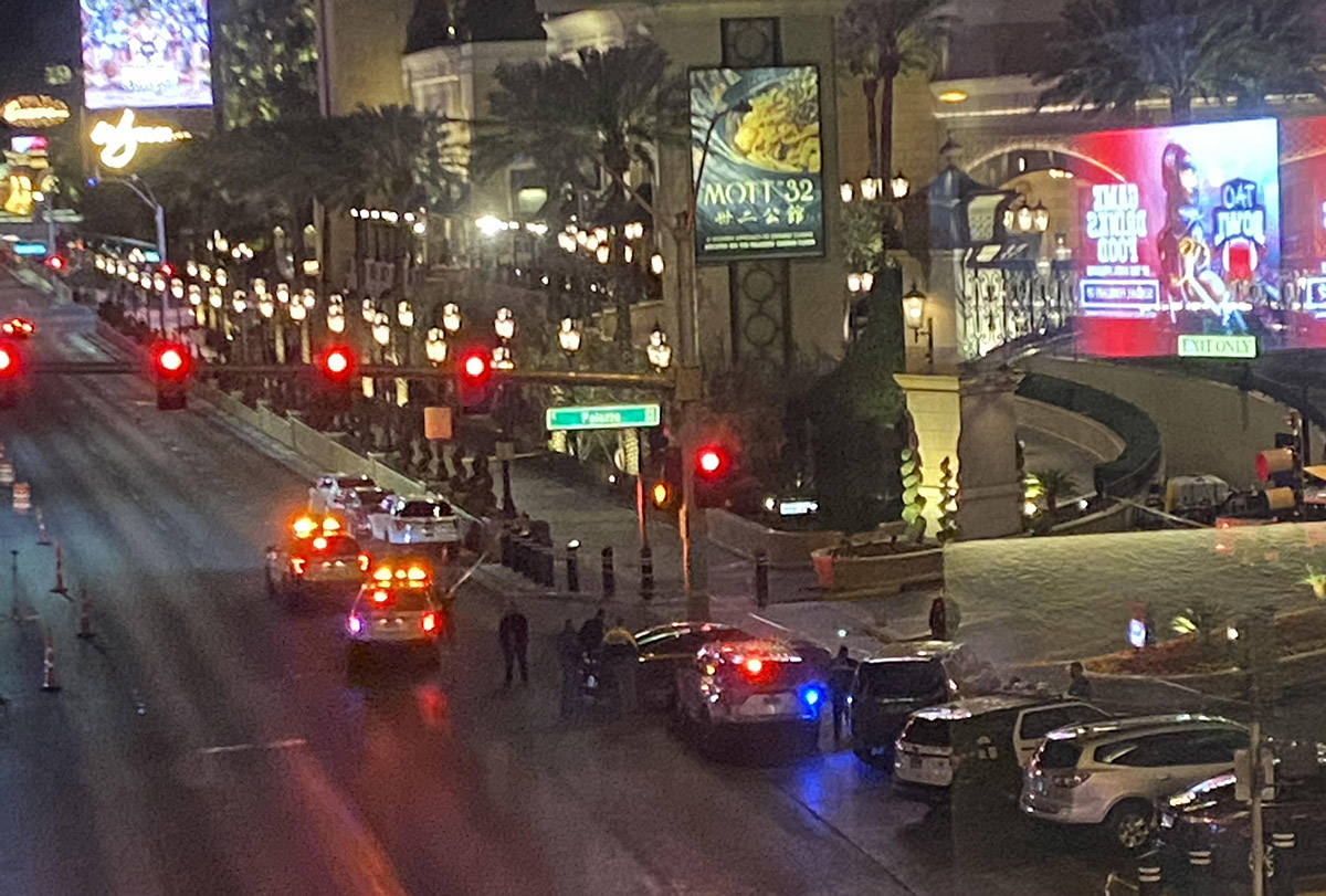 Las Vegas police vehicles on the Strip early Monday, Jan. 18, 2021, as officers investigate a s ...
